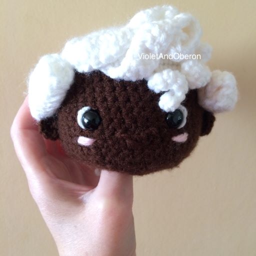 Joseph Bologne amigurumi with his wig sewed on and his face embellished